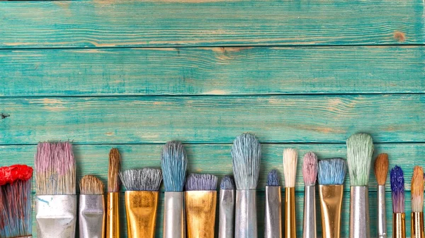 Row of artist paint brushes