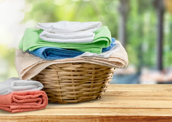 Laundry Basket with colorful towels — Stock Photo, Image