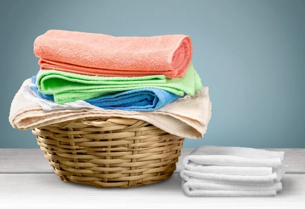 Laundry Basket with colorful towels — Stock Photo, Image