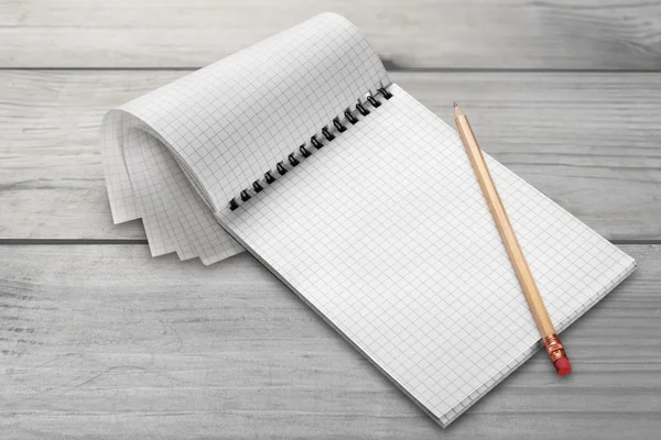 Blank notebook and pencil — Stock Photo, Image