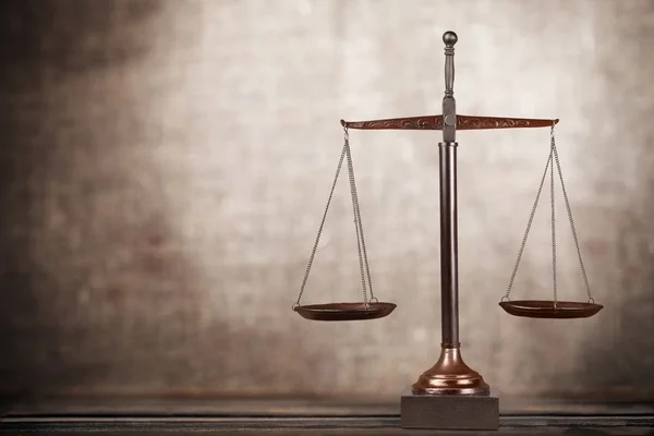 Scales of Justice on table — Stock Photo, Image