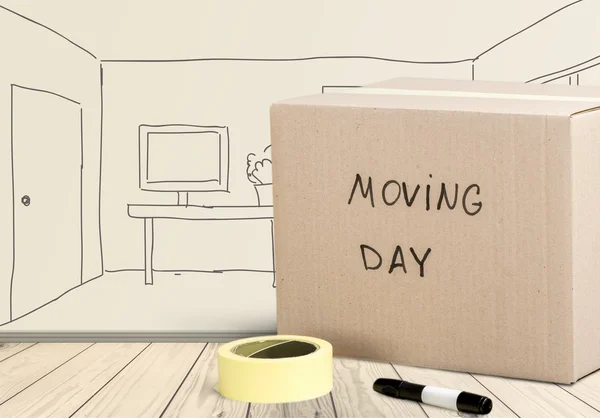 Картонный ящик с надписью "день переезда" — стоковое фото