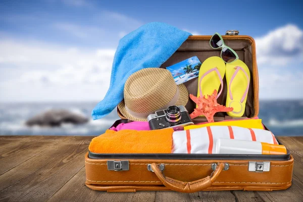 Retro suitcase with travel objects — Stock Photo, Image