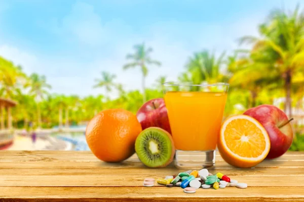 Tasty fruits  and juice with vitamins — Stock Photo, Image