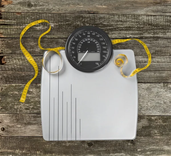 bathroom scale with a measuring tape