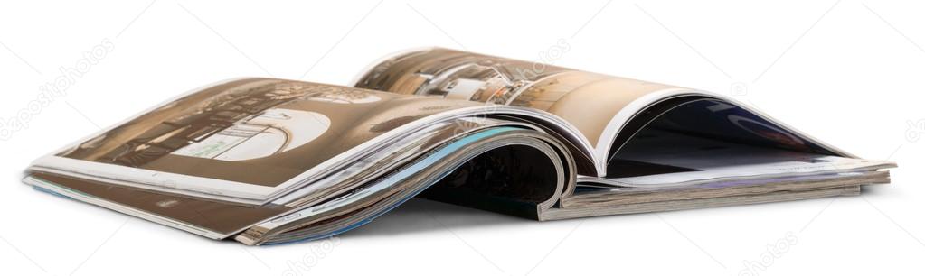 Stack of opened glossy magazines