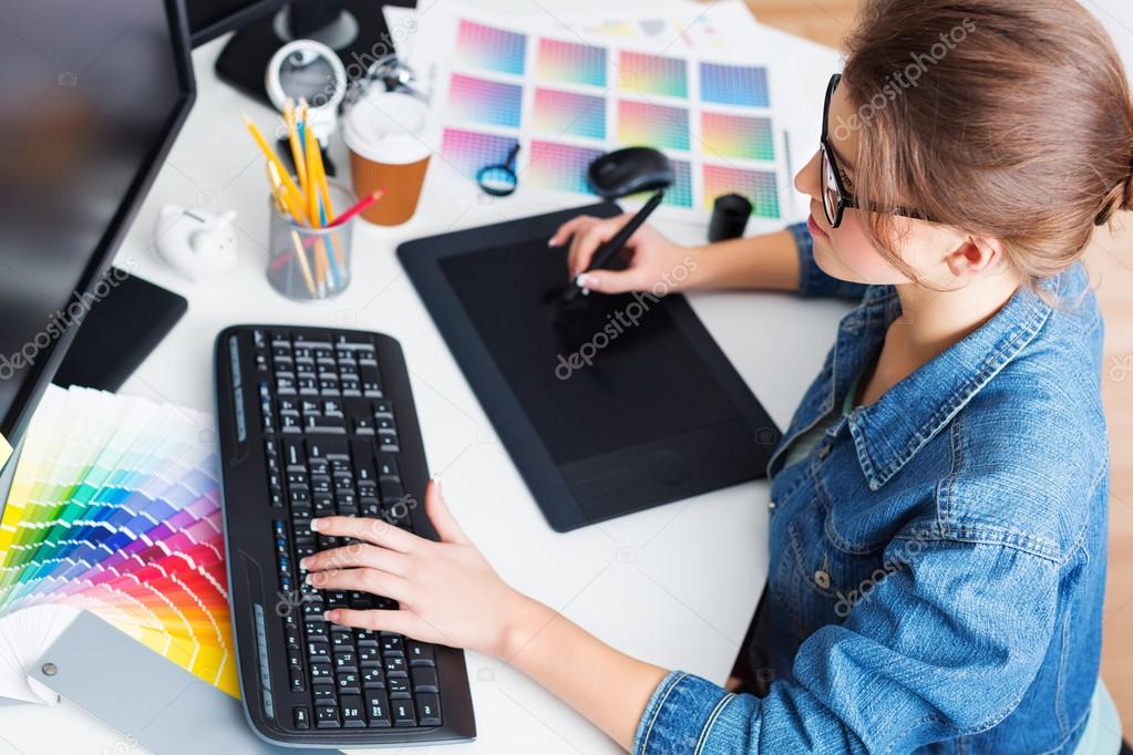 artist drawing something on graphic tablet 