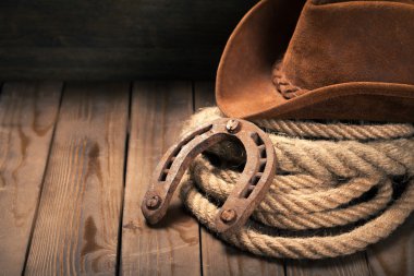 horseshoe , lariat lasso and cowboy hat  clipart