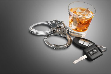 Whiskey with car keys and handcuffs clipart