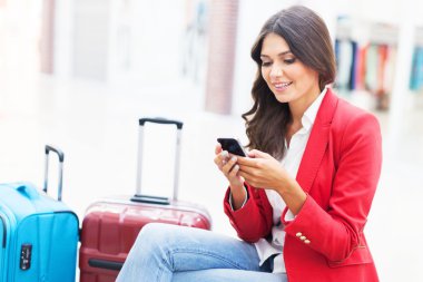 Young woman with travel bags