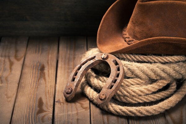 horseshoe , lariat lasso and cowboy hat 