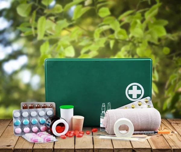 First aid kit  with medical supplies — Stock Photo, Image