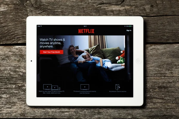 Netflix on white Apple iPad. — Stock Photo, Image