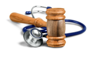 gavel and stethoscope  on background clipart