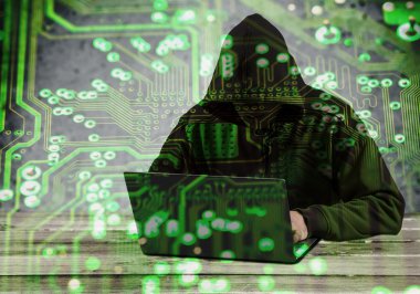 Hacker using laptop.  clipart