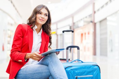young woman with travel bags