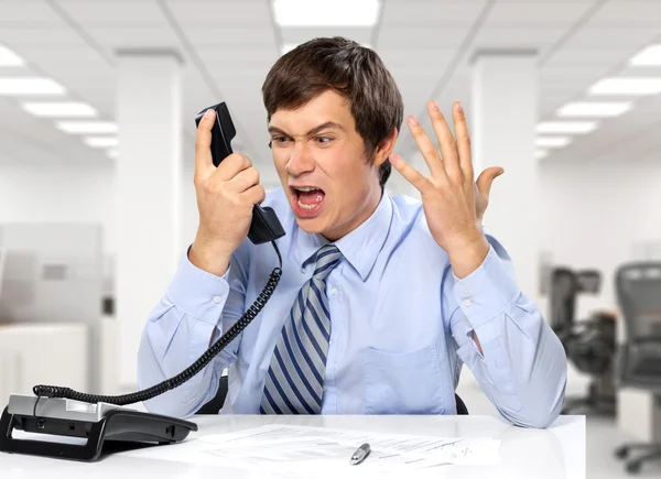 Young businessman with  phone — Stock Photo, Image