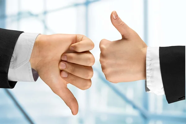 Hands showing agree sign Versus disagree — Stock Photo, Image