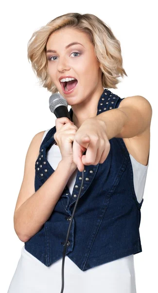 Woman singing into microphone — Stock Photo, Image