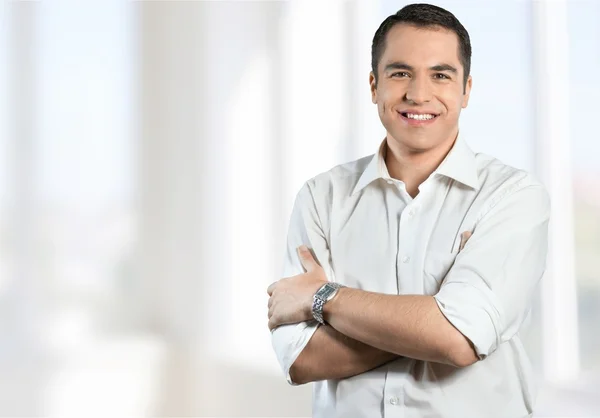 Confident businessman with crossed arms — Stock Photo, Image