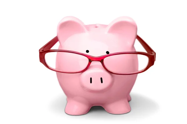 Piggy bank in glasses — Stock Photo, Image