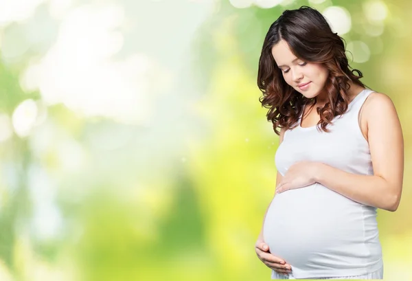 Giovane donna incinta — Foto Stock