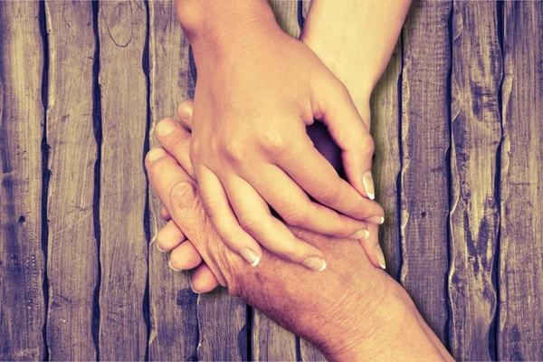 Hands of man and woman holding together — Stock Photo, Image