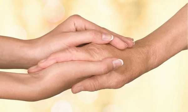 Hands of  old man and a young woman — Stock Photo, Image