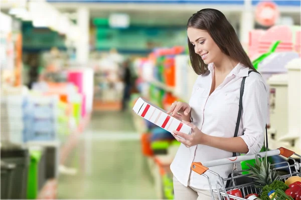 Woman with cart shopping — Stock Photo, Image