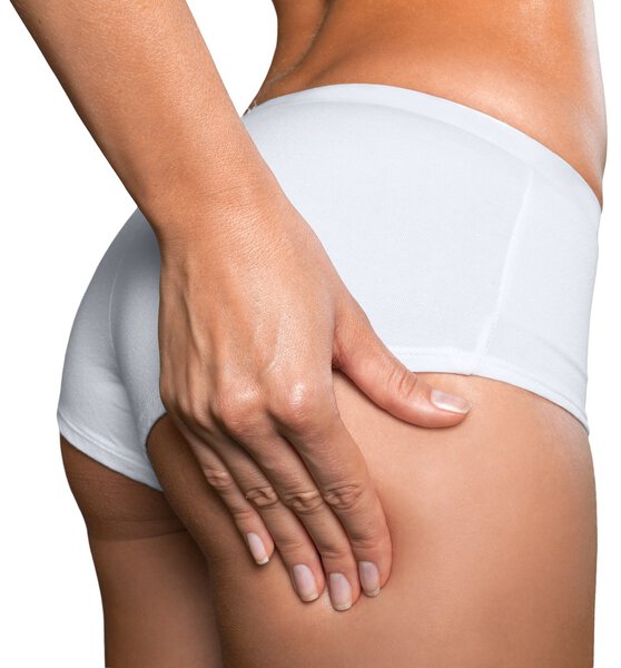 Woman checking cellulite on her buttocks