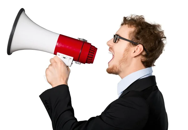 Businessman with megaphone shouting Royalty Free Stock Photos