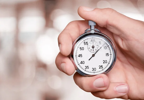 Stopwatch in Human Hand — Stock Photo, Image