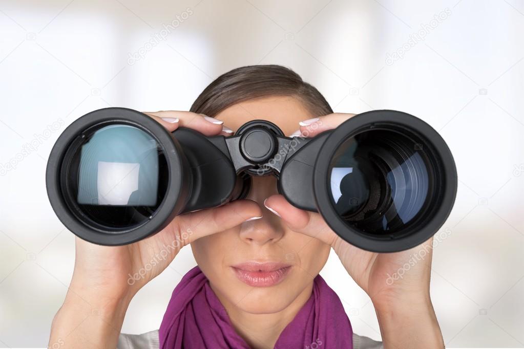 Girl looking into binoculars