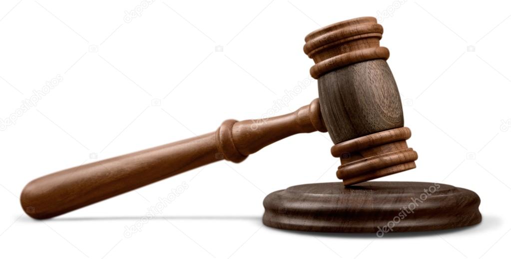 wooden gavel on wooden table