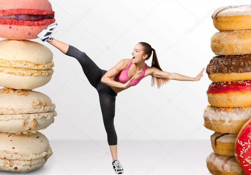 young woman fighting off fast food