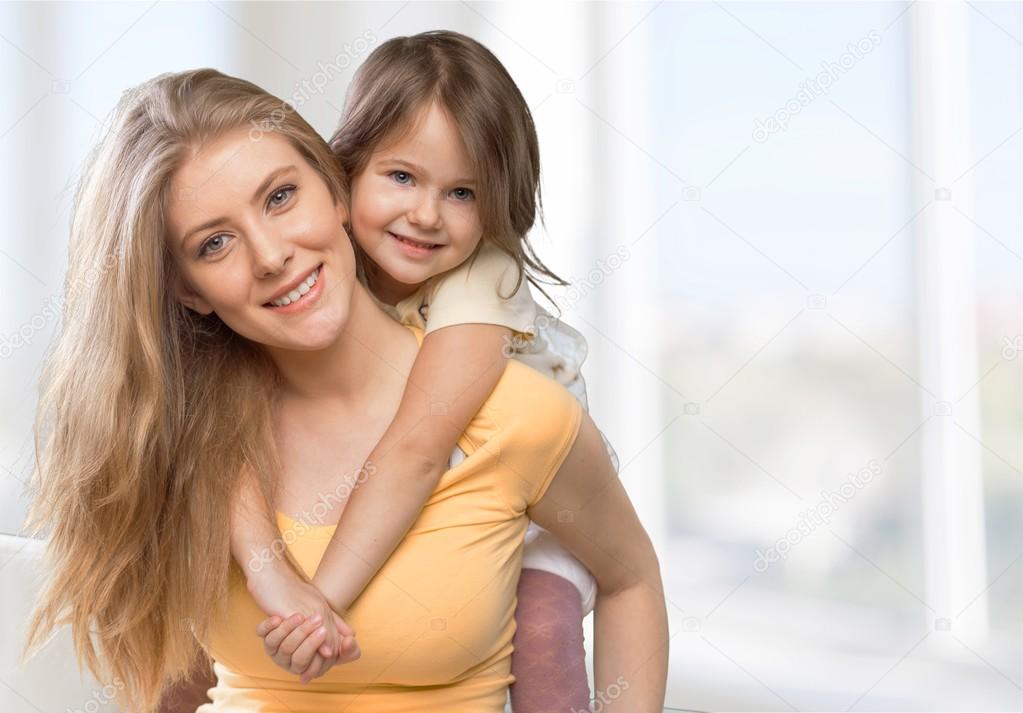 Mother and daughter hugging  