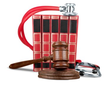 gavel and stethoscope  on background clipart