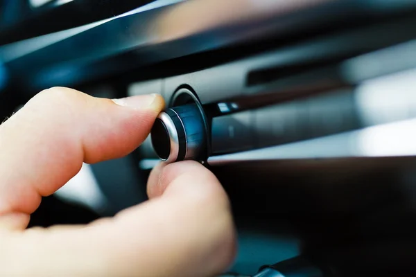 Male hand pushing the power button — Stock Photo, Image