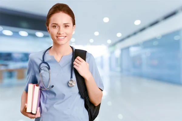 Zdravotní sestra student s knihami — Stock fotografie
