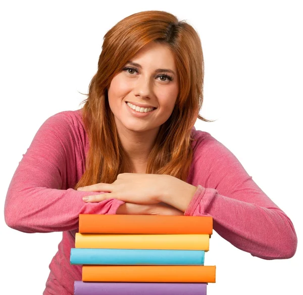 Hermosa chica con libros mirando a la cámara — Foto de Stock