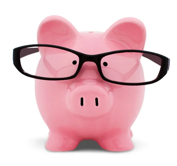 Piggy bank in glasses — Stock Photo, Image