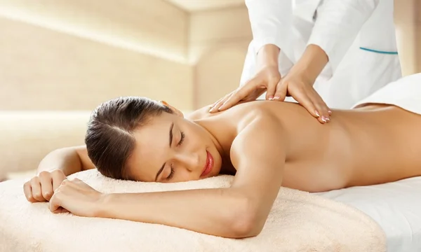 Woman relaxing with massage — Stock Photo, Image