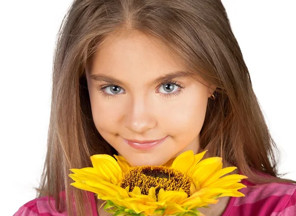 Cute little girl with sunflower — Stock Photo, Image