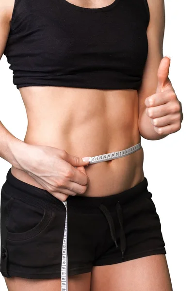 Young woman measuring her thin waist — Stock Photo, Image