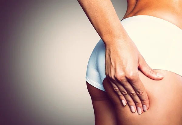 Woman with checking cellulite on her buttocks — Stock Photo, Image