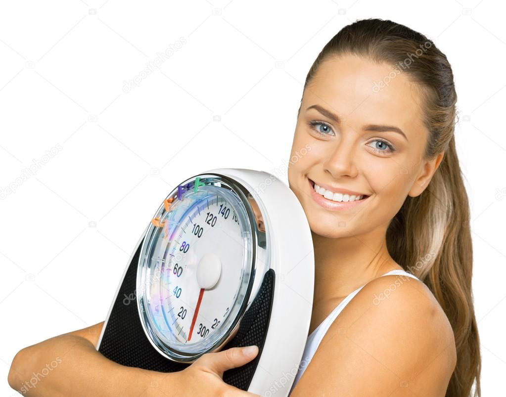young  woman holding scales