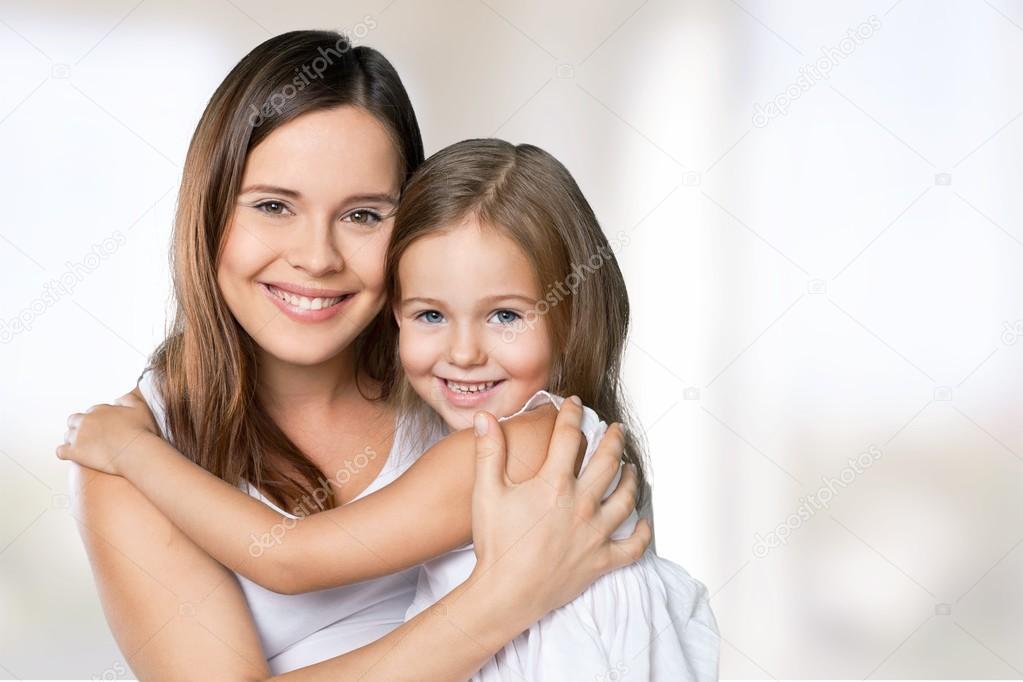 Mother and daughter hugging  