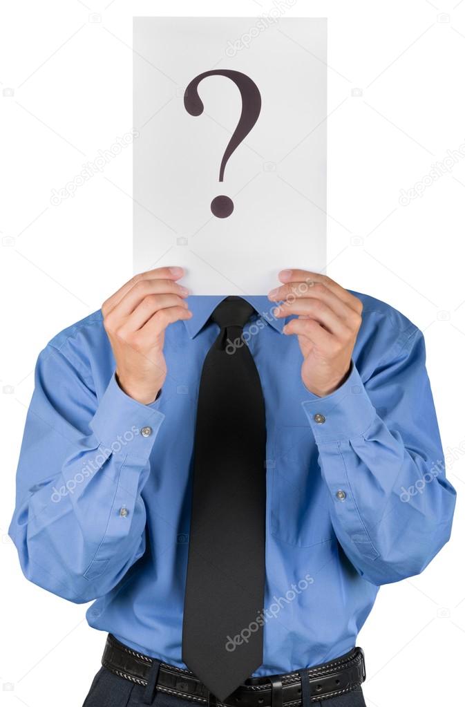 businessman holding paper with question marks