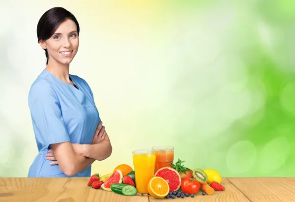 Medical nurse and healthy food — Stock Photo, Image