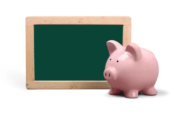 Pink piggy bank and chalkboard — Stock Photo, Image